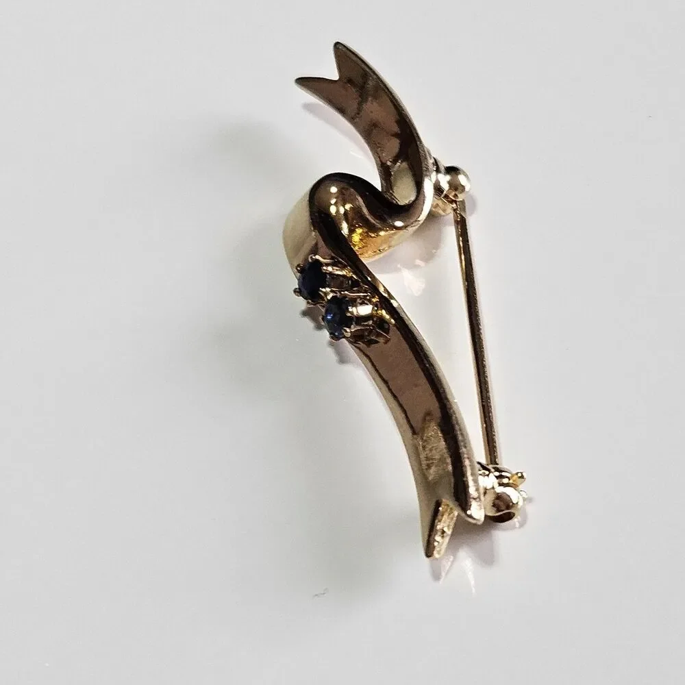 Avon Gold Tone Blue Stone Ribbon Pin Signed 1985